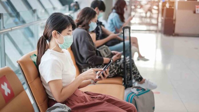 20201202-PAGEONE-Traveller-With-FaceMask.jpg